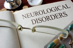 Book with diagnosis neurological disorders and pills Medical concept