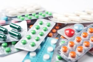 Pile of colorful medicine pills and capsules in blister packs - Bioresonance.org