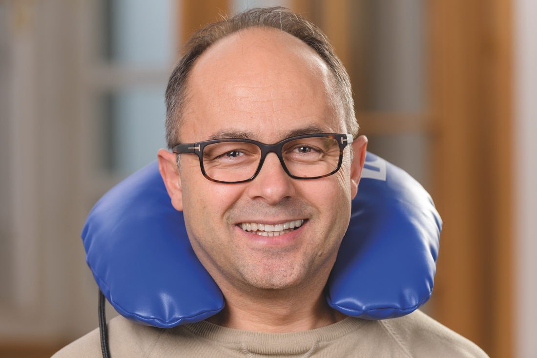 A client seated with the N1 neck applicator in place